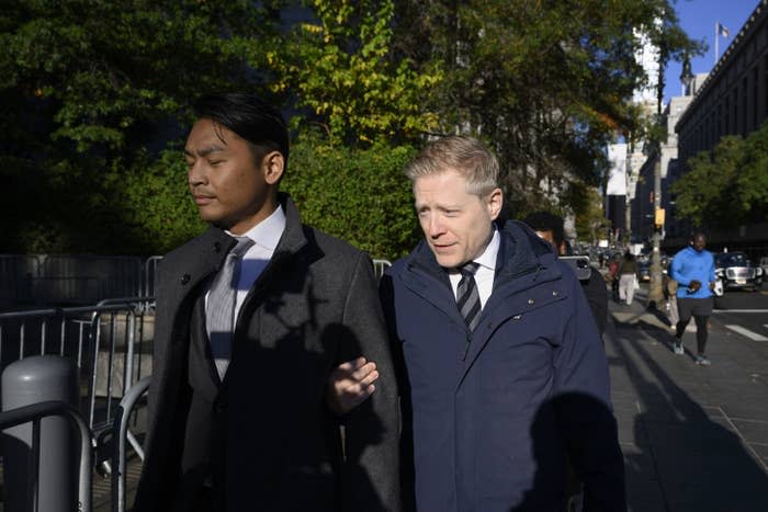 Actor Anthony Rapp (right) and his partner Ken Ithiphol arrive at Manhattan federal court on Oct. 19.