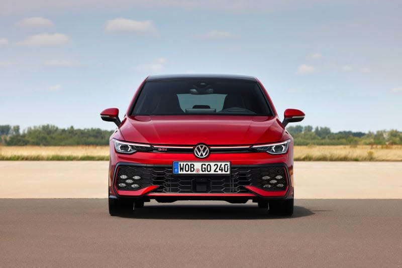 A head-on view of the new GTI in red. There are some slight enhancements to the car's grille design. 