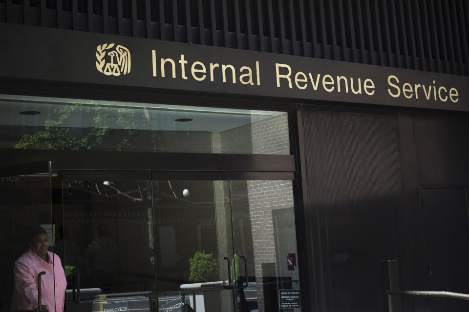 A woman walks out of the Internal Revenue Service building in New York. (Credit: Shannon Stapleton, Reuters).