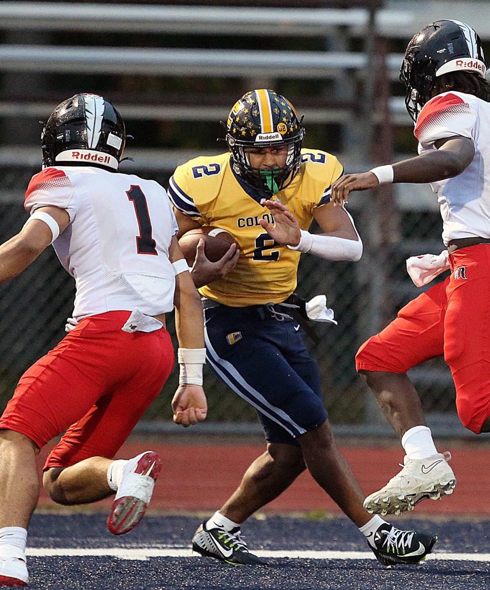 Colonia's Jaeden Jones runs as Rahway's Andrew Avent goes for a tackle in the football game on Oct. 20, 2023