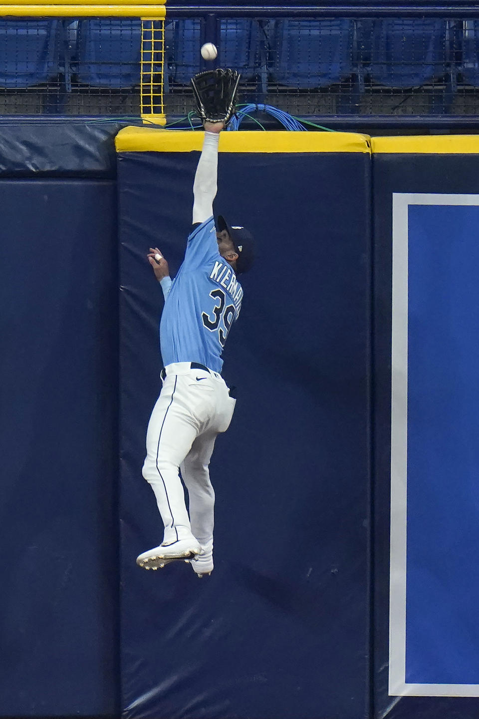 Tampa Bay Rays center fielder Kevin Kiermaier makes a leaping catch on a fly out by Kansas City Royals' Andrew Benintendi during the eighth inning of a baseball game Tuesday, May 25, 2021, in St. Petersburg, Fla. (AP Photo/Chris O'Meara)