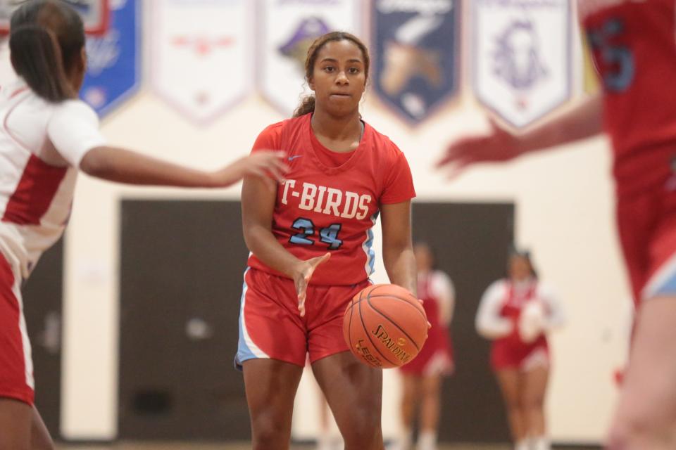 Shawnee Heights junior Breezy Canady (24) looks for an open pass around Wichita South during the first half of Thursday's Thunderbird Classic at Shawnee Heights.