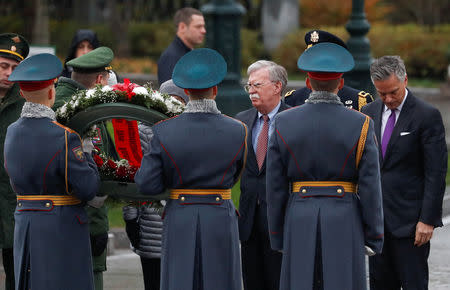 U.S. National Security Adviser John Bolton (2nd R) and U.S. ambassador to Russia Jon Huntsman (R) attend a wreath-laying ceremony at the Tomb of the Unknown Soldier by the Kremlin wall in Moscow, Russia October 23, 2018. REUTERS/Sergei Karpukhin