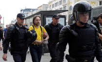 <p>Riot police detain a man during an anti-corruption protest organised by opposition leader Alexei Navalny, on Tverskaya Street in central Moscow, Russia, June 12, 2017. (Maxim Shemetov/Reuters) </p>