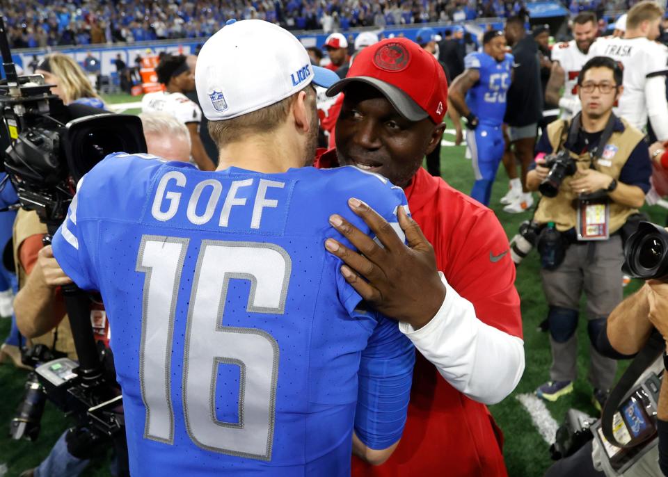 Detroit Lions quarterback Jared Goff and Tampa Bay Buccaneers head coach Todd Bowles hug at midfield at the end of the NFC divisional playoff game at Ford Field in Detroit on Sunday, Jan. 21, 2024.