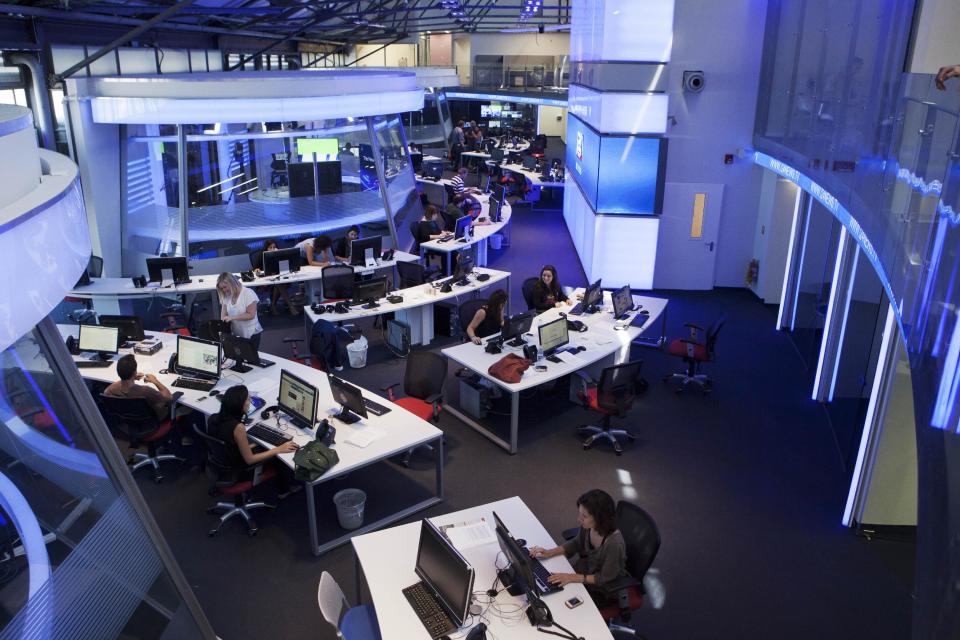 In this Sunday, July 28, 2013 photo, journalists works inside a studio of the new television channel I24news in Tel Aviv, Israel. The station's founders insist they are not an Israeli version of Al-Jazeera, the powerful broadcaster from the Gulf. They say they receive no government funding, hold no political affiliation and pledge to cover the news dispassionately and objectively. (AP Photo/Dan Balilty)