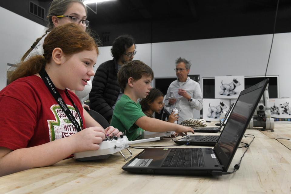 Teagan Myers tries her hand a piloting a drone using a computer-based flight simulator during and Open Robotics Day at the Hsu Inovation Institute in Fort Walton Beach.