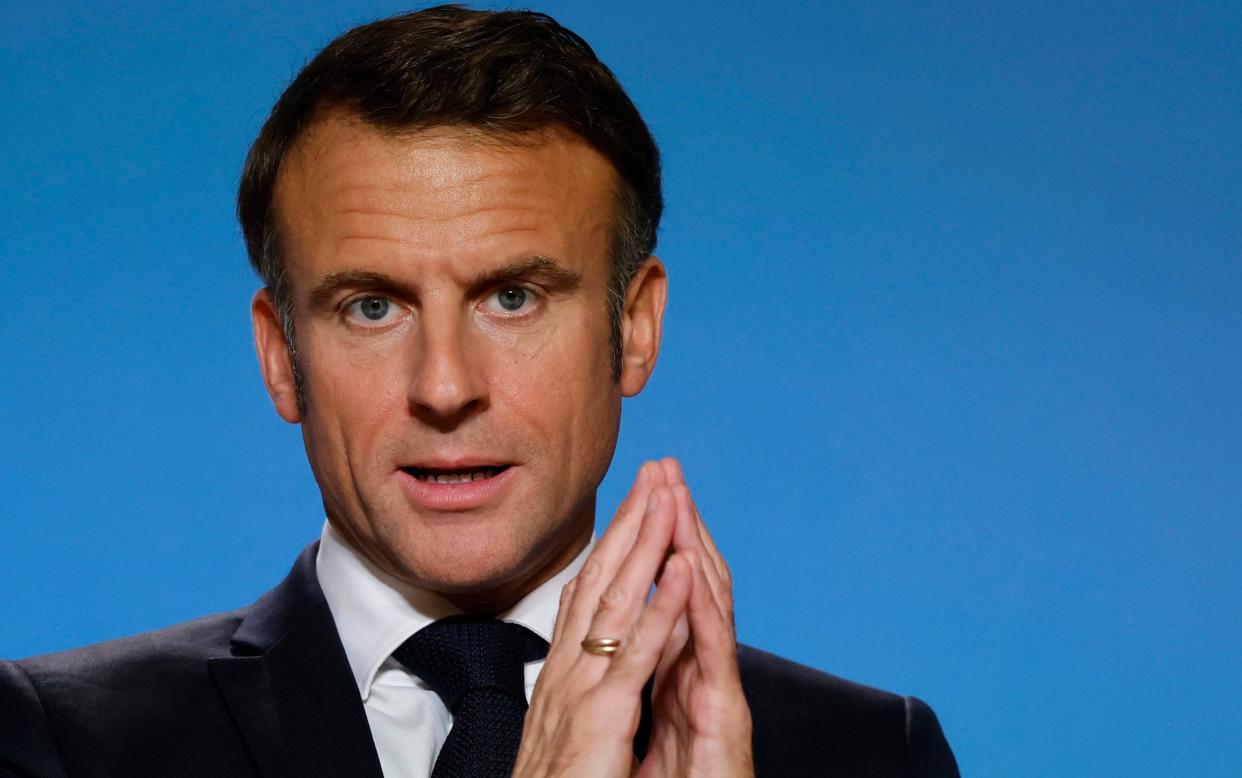 Emmanuel Macron steeples his fingers as he speaks