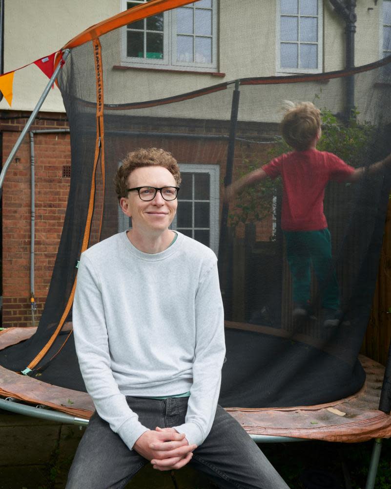 Tom Lamont in his garden with his son