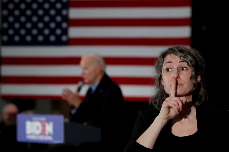 A a sign language interpreter is seen as Democratic 2020 U.S. presidential candidate and former Vice President Joe Biden speaks during a campaign event in Waterloo, Iowa, U.S.