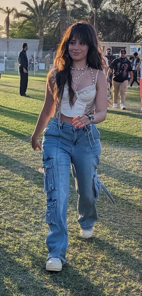 Camila Cabello, jeans, blue jeans, corset, corset top, sneakers, white sneakers, chunky sneakers, platforms, platform sneakers, womens sneakers, lace up sneakers, Coachella, music festival, California, Coachella Day 1, Bad Bunny, performance, music, musical performance, concert