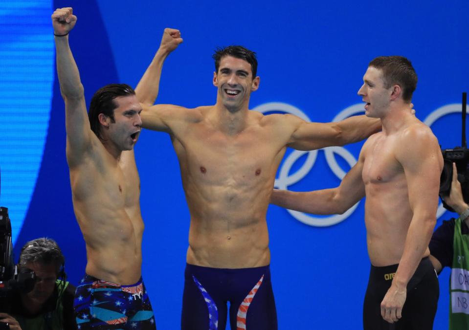 <p>Cody Miller, Michael Phelps and Ryan Murphy of the United States celebrate winning gold in the Men’s 4 x 100m Medley Relay Final on Day 8 of the Rio 2016 Olympic Games at the Olympic Aquatics Stadium on August 13, 2016 in Rio de Janeiro, Brazil. (Photo by Tom Pennington/Getty Images) </p>