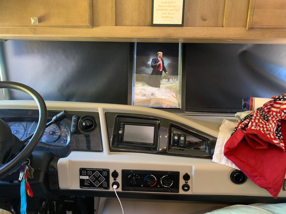 The inside of an RV parked with a photo of Donald Trump at the windshield. It's part of a caravan of Trump supporters in Wilmington to hear him speak at a rally.