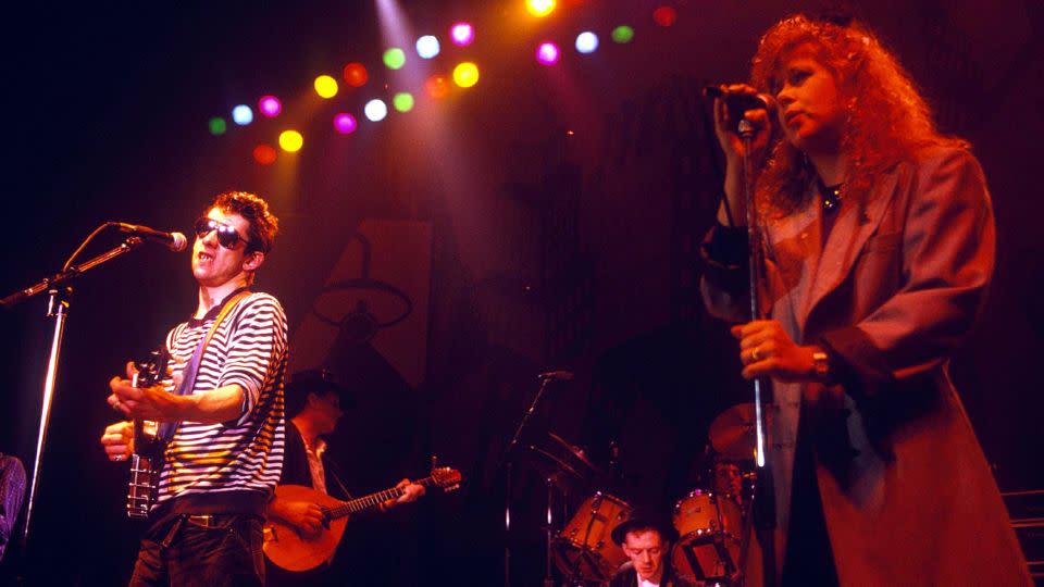 Shane MacGowan performs with Kirsty MacColl in 1988. - Brian Rasic/Getty Images