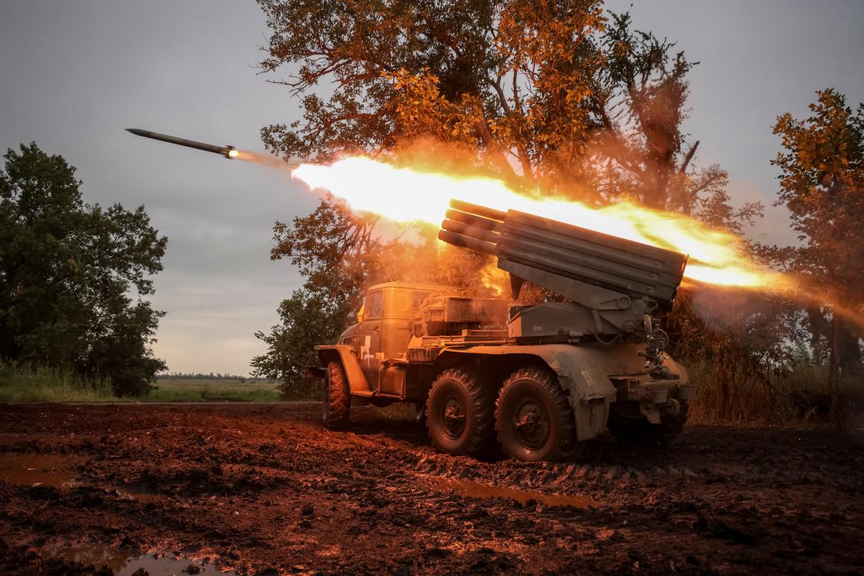 Ukrainian servicemen fire a BM-21 Grad multiple launch rocket system towards Russian troops near a front line (REUTERS)