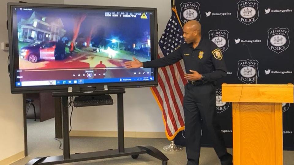 Police Chief Eric Hawkins shows the officer's body-worn camera footage of his encounter with the suspect.