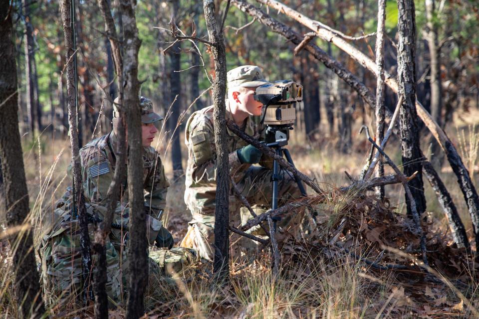 Soldiers try out the Joint Effects Targeting System. This system, still fielding to forward observers, lightens the load to 19 pounds and allows a single soldier to carry, set up and operate the gear. (Army)