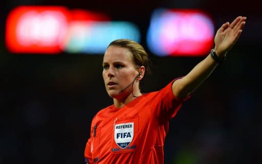 Referee Christina Pedersen of Norway officiates during the London 2012 Olympic Games women's semi-final football match between the US and Canada at Old Trafford in Manchester. USA won 4-3 in extra time