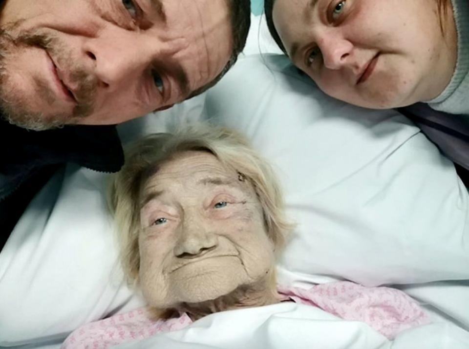 Mrs Bunting, pictured with son Mark and his partner Gemma, was due to come out of hospital on the day of the attack (SWNS)