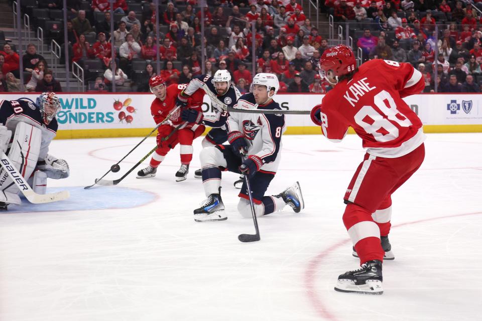 Patrick Kane of the Detroit Red Wings scores past Daniil Tarasov of the Columbus Blue Jackets to win 4-3 in overtime at Little Caesars Arena in Detroit on Tuesday, March 19, 2024.