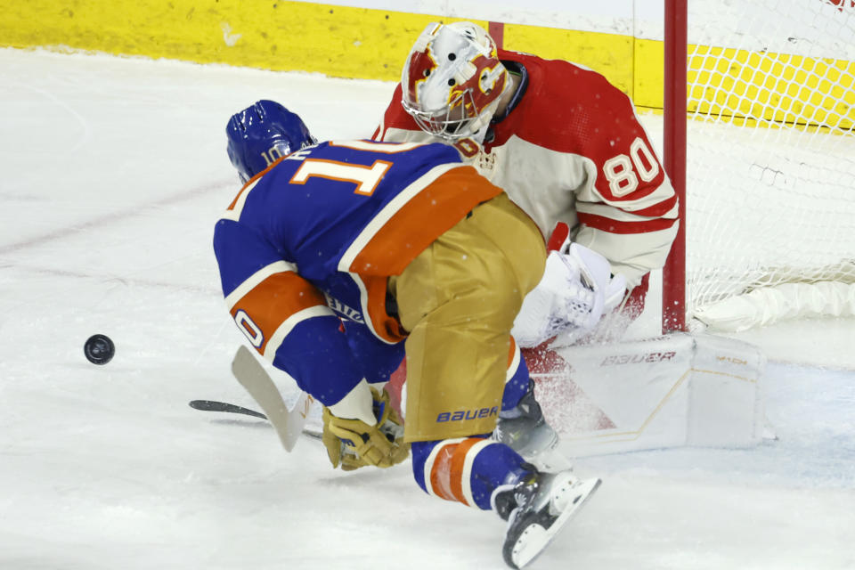Edmonton Oilers' Derek Ryan is stopped by Calgary Flames goalie Dan Vladar during the first period of an NHL hockey game Saturday, Jan. 20, 2024, in Calgary, Alberta. (Larry MacDougal/The Canadian Press via AP)
