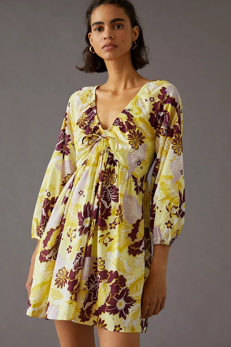 By Anthropologie V-Neck Mini Dress. Image via Anthropologie.