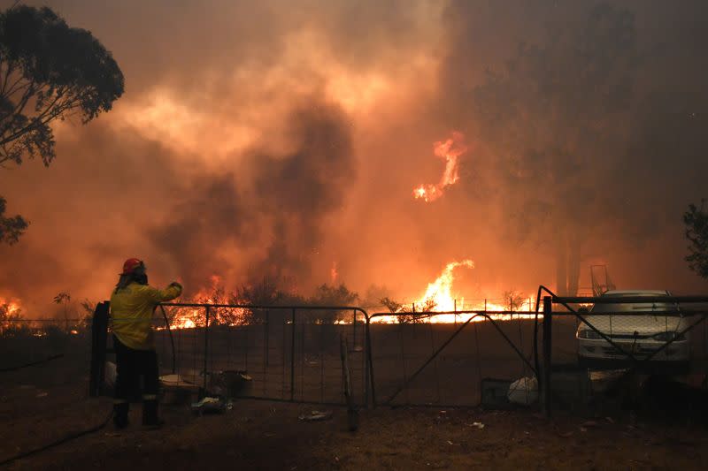 RFS crews engage in property protection of a number of homes along the Old Hume Highway as the Green Wattle Creek Fire threatens a number of communities in the southwest of Sydney