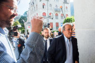 The former president of the the European Football Association (UEFA), Michel Platini, right, arrives at the Swiss Federal Criminal Court in Bellinzona, Switzerland, Wednesday, June 8, 2022. Platini and the former president of the World Football Association (Fifa), Joseph Blatter, will stand trial before the Federal Criminal Court from Wednesday, over a suspicious two-million payment. (Alessandro Crinari/Keystone via AP)