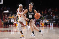 Stanford guard Talana Lepolo, right, drives toward the basket as Southern California guard Kayla Williams defends during the first half of an NCAA college basketball game Sunday, Jan. 15, 2023, in Los Angeles. (AP Photo/Mark J. Terrill)