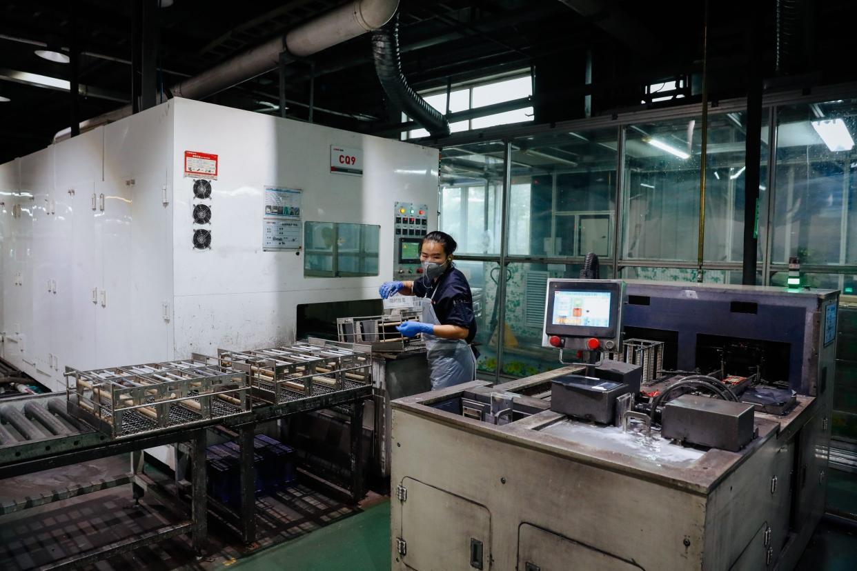 Mandatory Credit: Photo by ROMAN PILIPEY/EPA-EFE/Shutterstock (9896428o)An employee works at the production line of Longi Silicon company in Xi'an, the capital of Shaanxi Province, China, 26 September 2018.