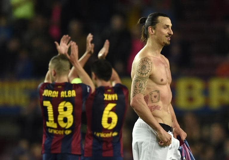 Paris Saint-Germain's forward Zlatan Ibrahimovic (R) leaves the pitch at the end of the UEFA Champions League quarter-finals second leg football match in Barcelona on April 21, 2015