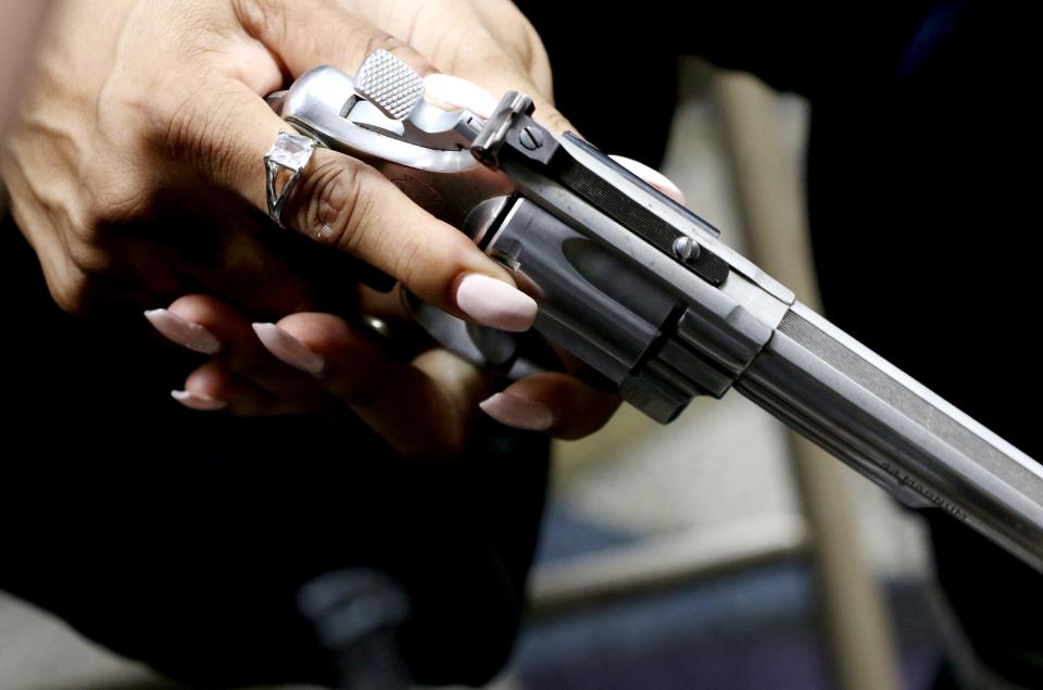 Amy Johnson of Mt. Auburn holds an unloaded 44 Magnum during a concealed carry weapon (CCW) class at New Prospect Church in Roselawn. Saturday, Feb. 8, 2020. 'We need to learn as women.. know I need knowledge on gun safety and gun laws'.  Johnson said.