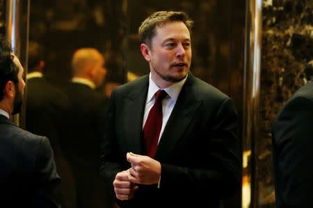 Tesla chief executive Elon Musk enters the lobby of Trump Tower. Trump named Musk to a business advisory council that will give private-sector input to Trump after he takes office. REUTERS/Shannon Stapleton