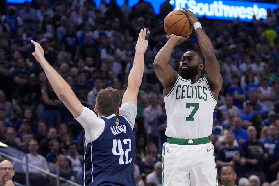 Boston Celtics guard Jaylen Brown (7) shoots against Dallas Mavericks forward Maxi Kleber (42) during the second half in Game 3 of the NBA basketball finals, Wednesday, June 12, 2024, in Dallas. (AP Photo/Tony Gutierrez)