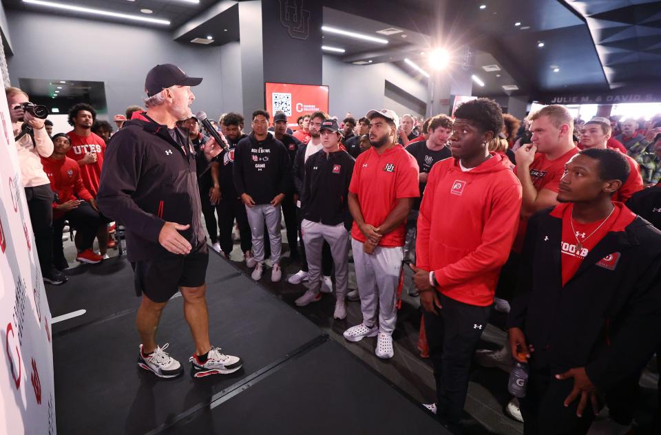 Utah Utes head coach Kyle Whittingham talks with scholarship football players as they celebrate getting a Dodge truck given to them by the Crimson Collective during an NIL announcement at Rice-Eccles Stadium in Salt Lake City on Wednesday, Oct. 4, 2023. | Jeffrey D. Allred, Deseret News