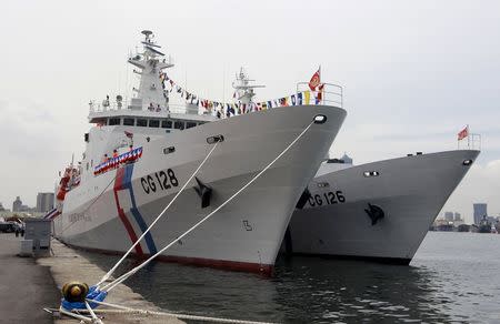 Taiwan Coast Guard's new patrol ship, the 3000-ton "Ilan" (L), is seen during a commissioning ceremony in the port of Kaohsiung, southern Taiwan, June 6, 2015. REUTERS/Pichi Chuang