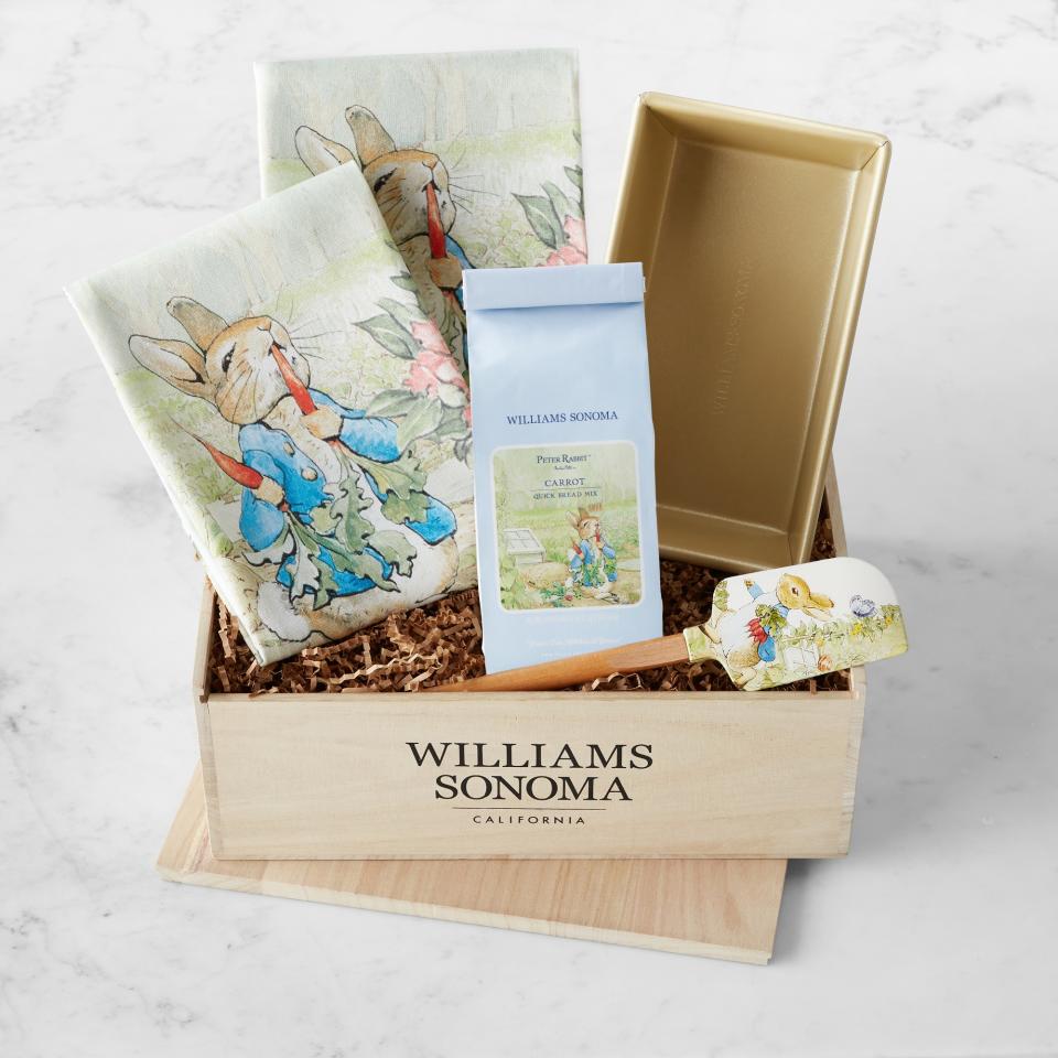 crate with Peter Rabbit pattered towels, coffee and baking utensil