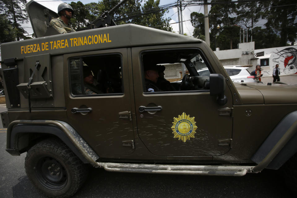 An armed army vehicle patrols in front of the United Nations International Commission Against Impunity, CICIG, headquarters in Guatemala City, Friday, Aug. 31, 2018. Guatemala president Jimmy Morales says he is not renewing mandate of U.N.-sponsored commission investigating corruption in the country. (AP Photo)