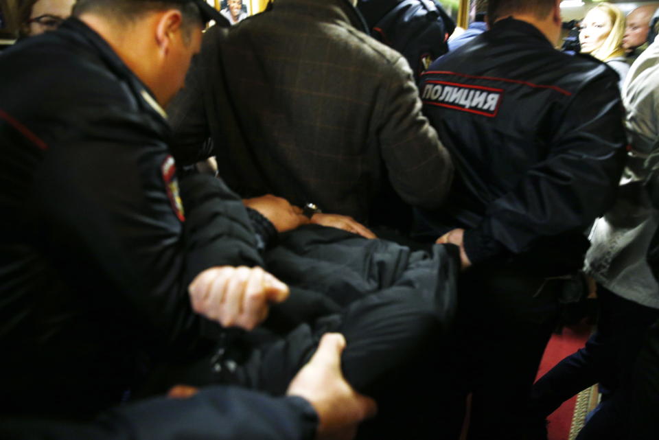 Police officers detain the man who attacked Tatyana Felgenhauer, a radio journalist&nbsp;at the Ekho Moskvy radio station in Moscow.&nbsp; (Photo: Alexander Shcherbak via Getty Images)