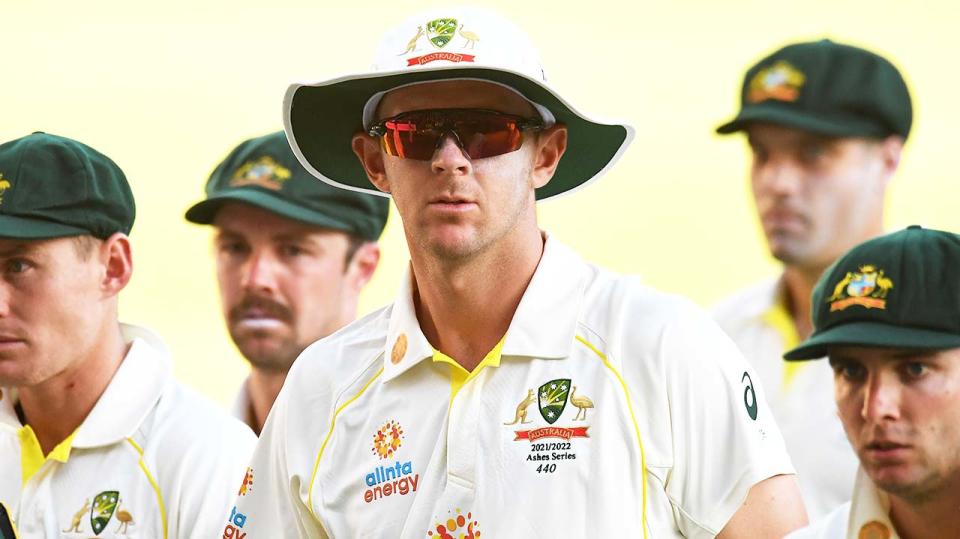 Josh Hazlewood (pictured middle) walks off the field after Day 3.
