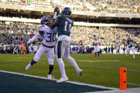 Philadelphia Eagles' A.J. Brown catches the ball for a touchdown in front of Tennessee Titans' Tre Avery during the second half of an NFL football game, Sunday, Dec. 4, 2022, in Philadelphia. (AP Photo/Matt Slocum)