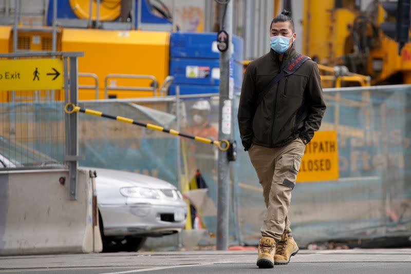 A man wears a face mask in Melbourne, the first city in Australia to enforce mask-wearing to curb a resurgence of COVID-19