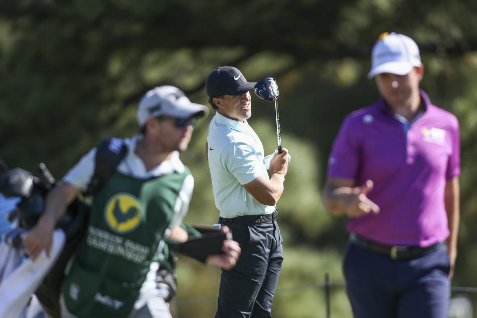 Cameron Champ, center, watches his shot from the ninth tee box during the final round of the Sanderson Farms Championship golf tournament in Jackson, Miss., Sunday, Oct. 8, 2023. (James Pugh/impact601.com via AP)