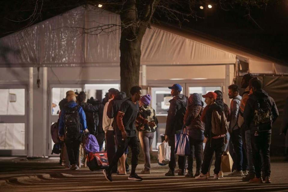 Migrants waiting to enter a shelter on Randall’s Island on April 9, 2024. AP Photo/Andres Kudacki