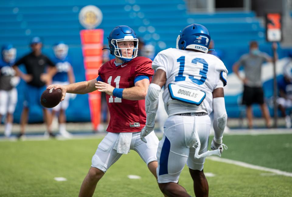 Freshman quarterback Beau Allen throws a pass during a preseason practice for Kentucky football.