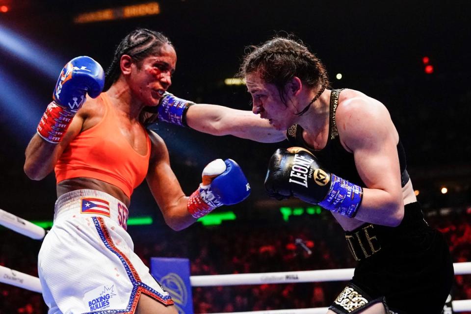 Katie Taylor (right) remained undisputed lightweight champion after edging past Amanda Serrano at Madison Square Garden (AP)