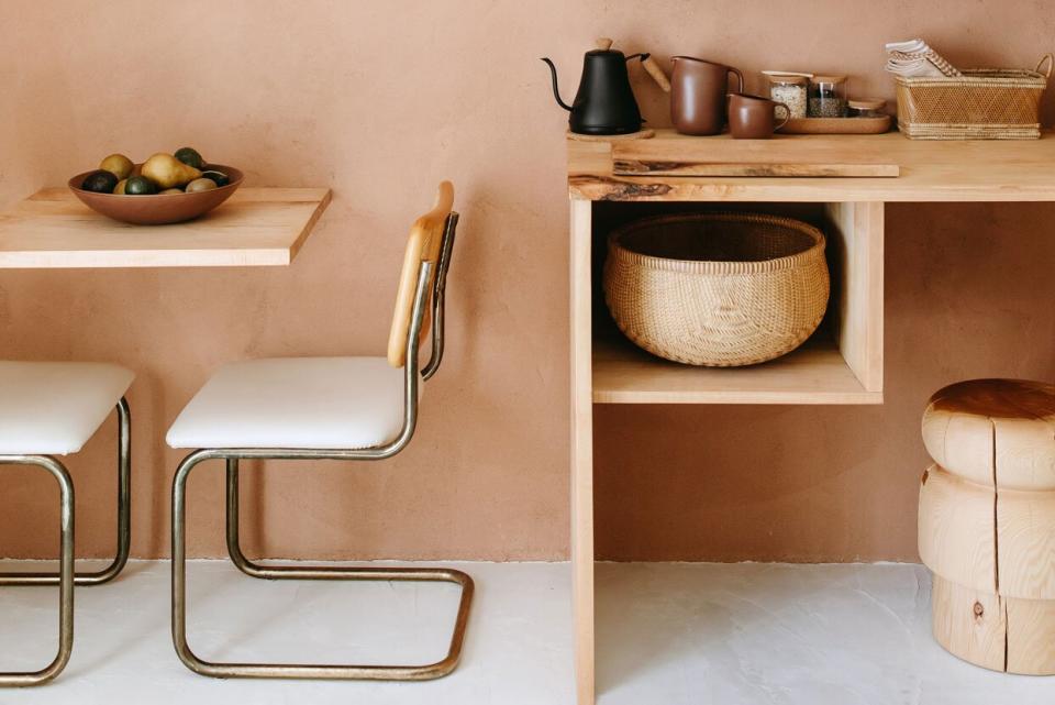 warm-toned, orange kitchen with seating and storage