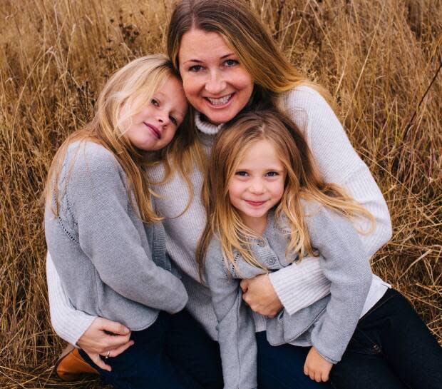 Chloe and Aubrey Berry, photographed with their mother Sarah Cotton. The young girls were killed by their father in 2017.  (Ryan MacDonald Photography - image credit)