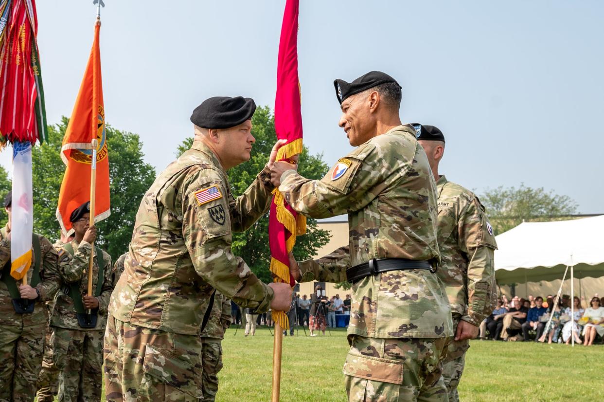 Col. James L. Crocker (left) receives the Tobyhanna Army Depot flag from Maj. Gen. Robert L. Edmonson II (right), signifying his assumption of command of Tobyhanna Army Depot on June 29, 2023.