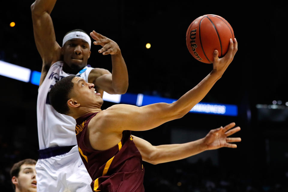 <p>Lucas Williamson #1 of the Loyola Ramblers drives to the basket against Xavier Sneed #20 of the Kansas State Wildcats in the second half during the 2018 NCAA Men’s Basketball Tournament South Regional at Philips Arena on March 24, 2018 in Atlanta, Georgia. (Photo by Kevin C. Cox/Getty Images) </p>